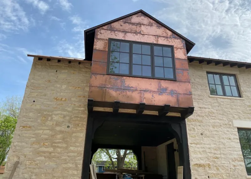 Copper metal panel facade on a stone building for Skylight Installation in Bountiful