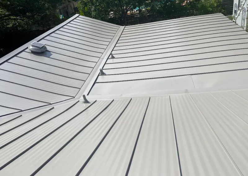 Solar attic fan installed on a metal roof for Roof Ventilation in Bountiful